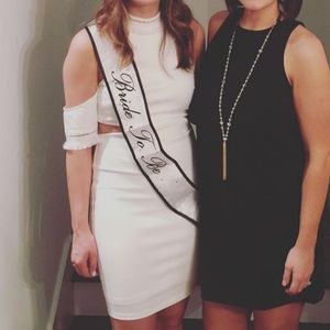 White cold shoulder and open back dress